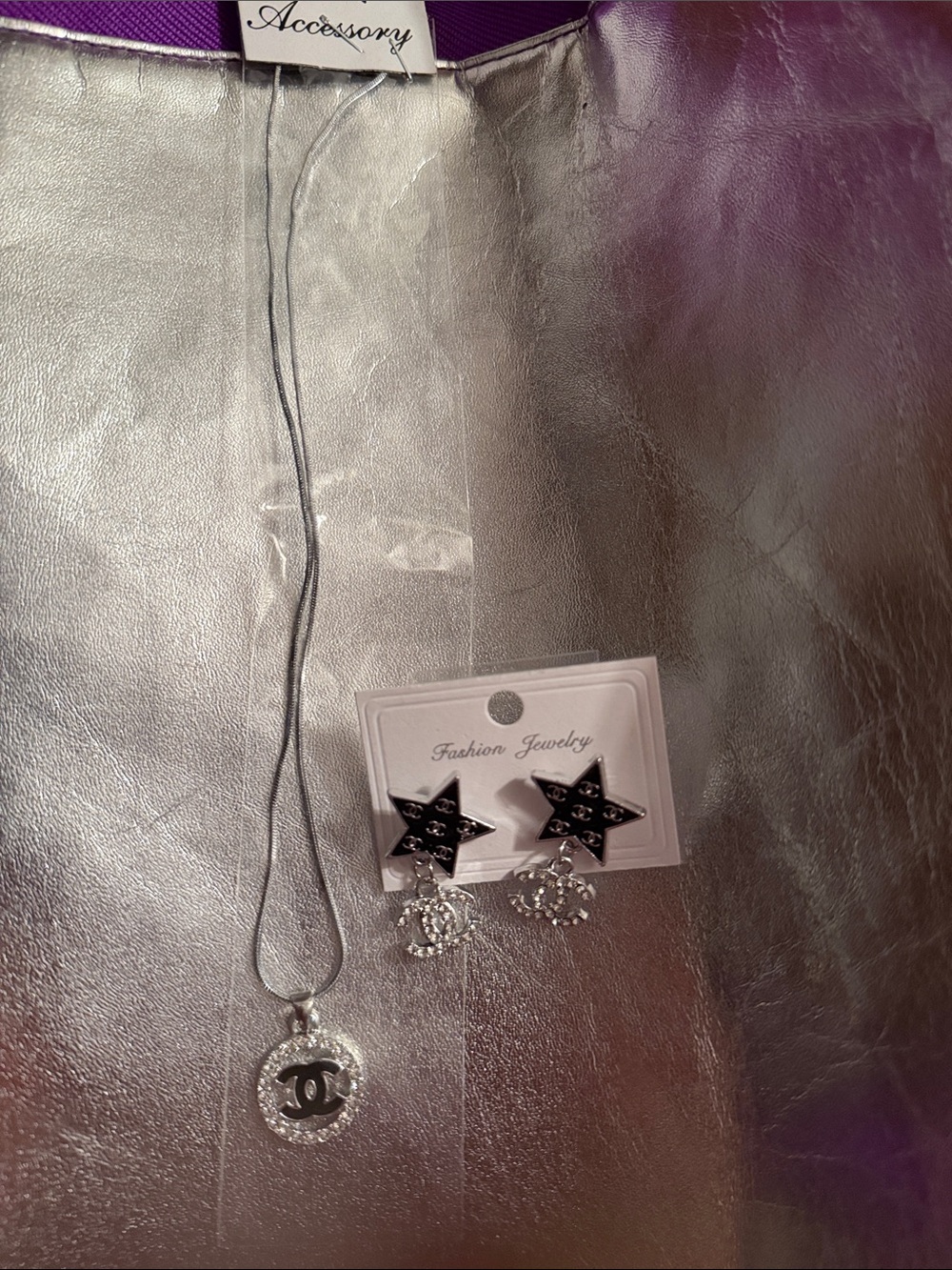 Multiples Silver Tone Star Earrings and Logo Pendant Necklace